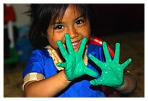 Child with paint on hands